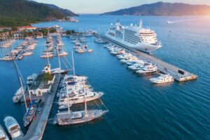 Aerial view of beautiful large white ship at sunset