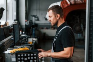 Work in progress. Man in uniform is in the auto service