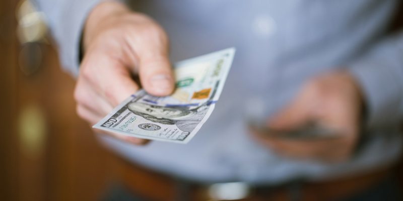 Businessman holding money in his hands