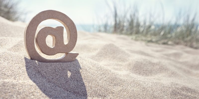 E-mail @ symbol at the beach