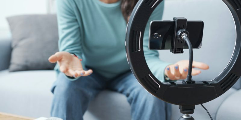 Girl recording videos for social media at home