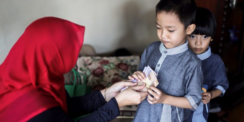 Muslim Family Giving Each Other