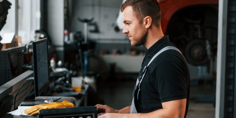 Work in progress. Man in uniform is in the auto service